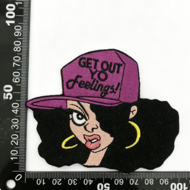 Cartoon woman with purple cap and yellow hoop earrings patch