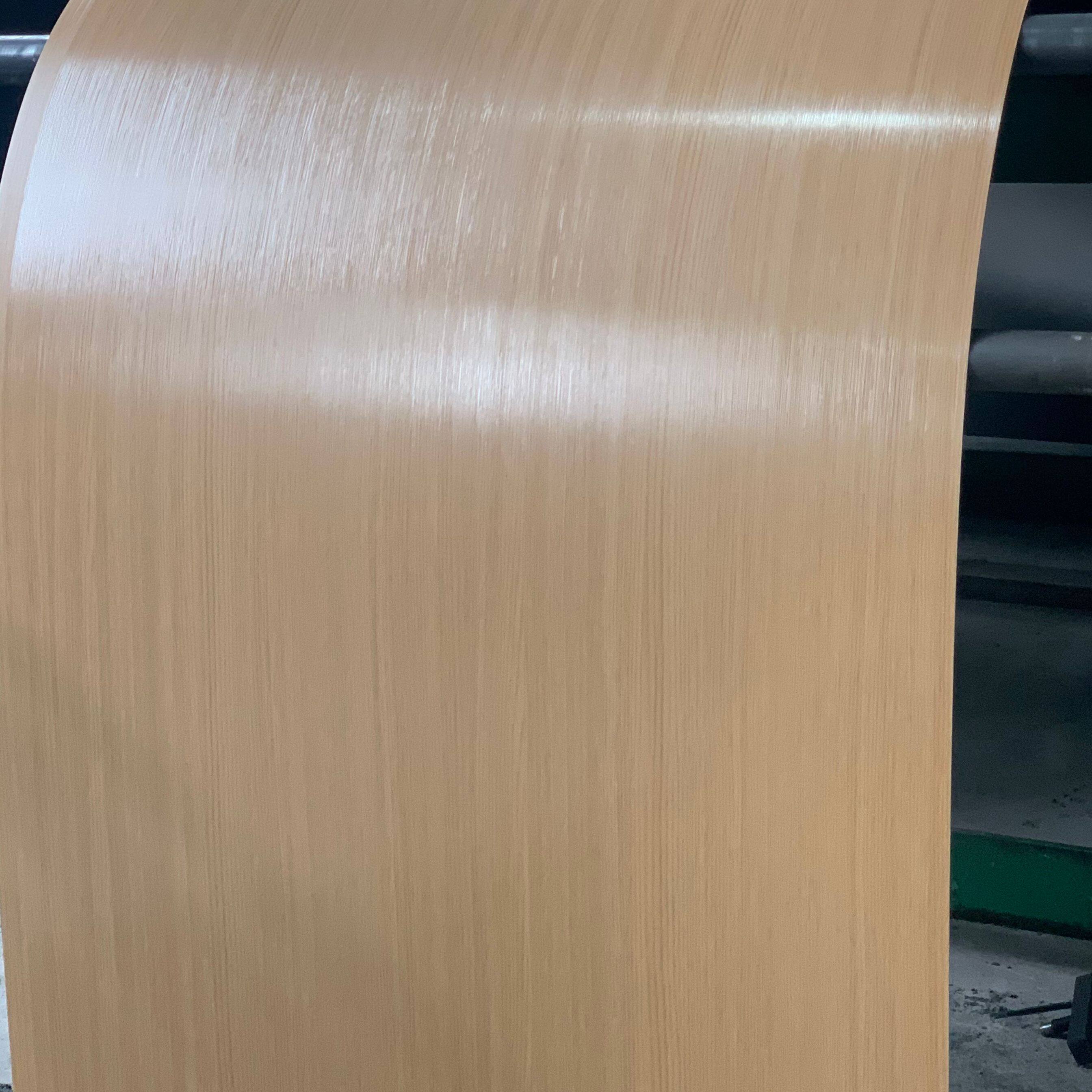 Production of light wood-grain laminated steel sheets