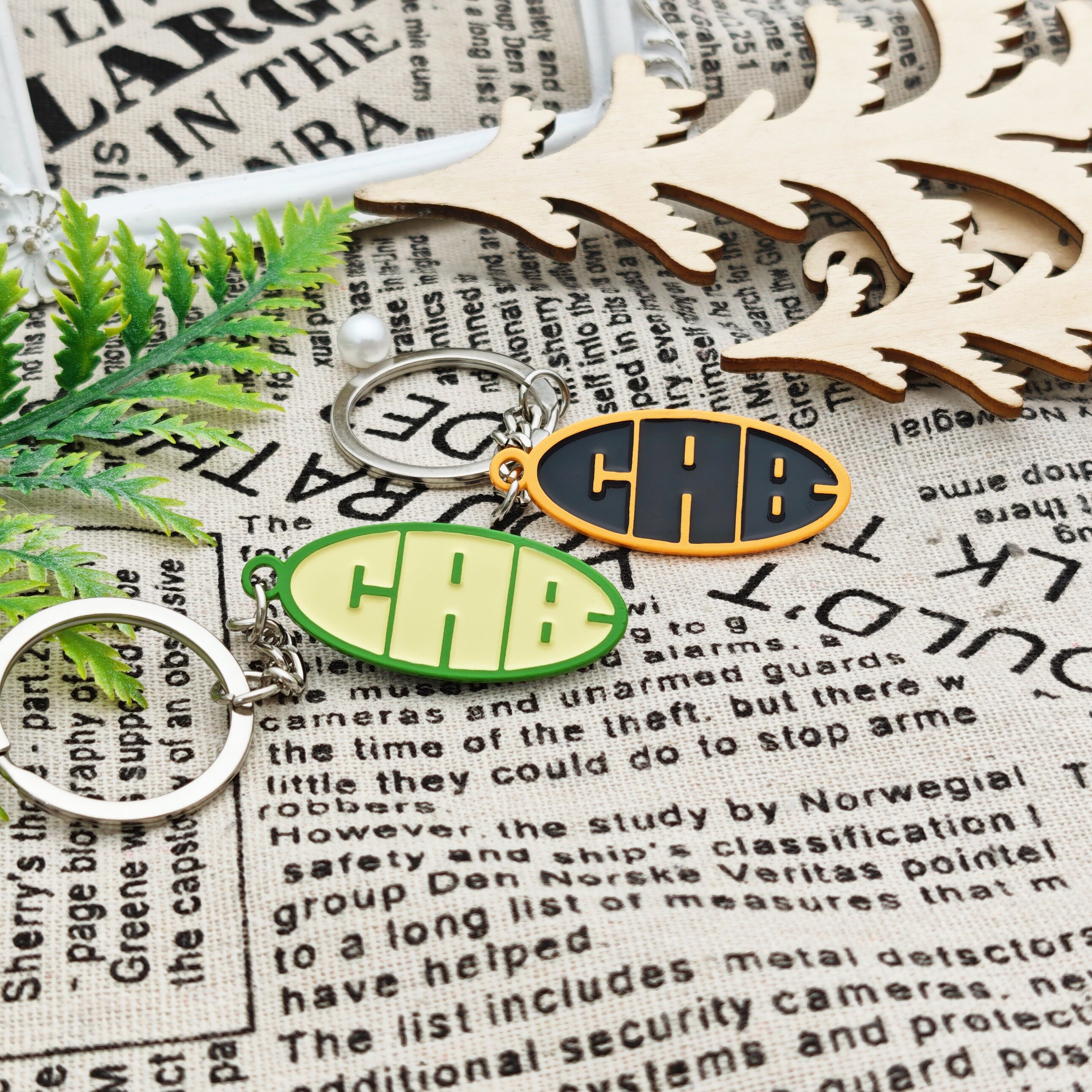 CAB Abstract Text Oval Keychain