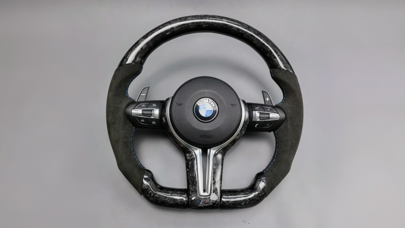BMW F30 interior cockpit view with custom carbon fiber steering wheel