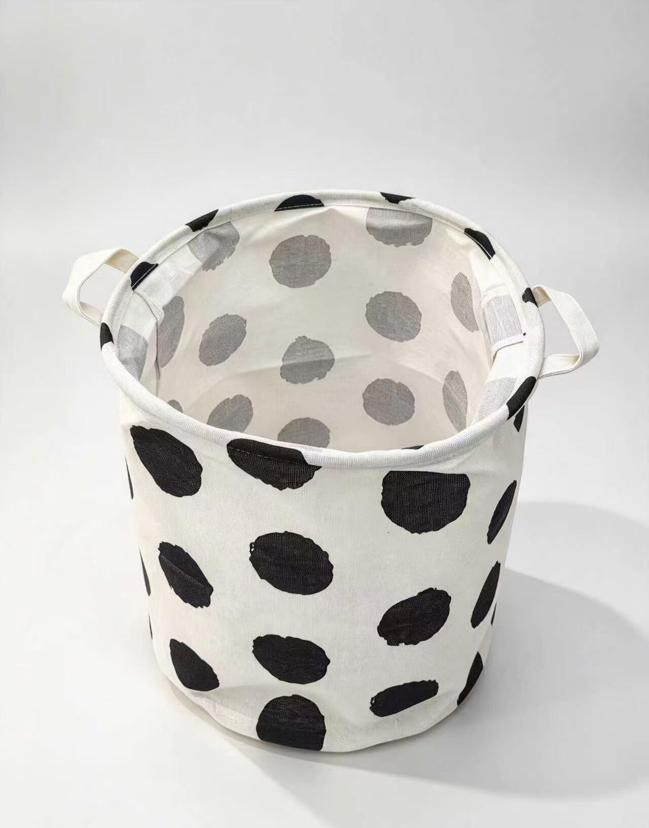Black-and-white polka dot linen storage bin