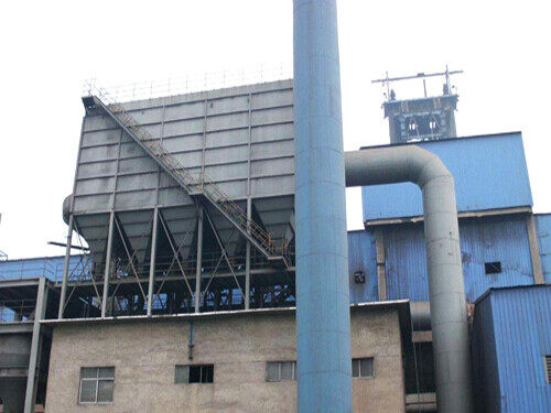 Offline pulse baghouse on a steel support frame above a cast house roof with large duct to the plant and stack in front