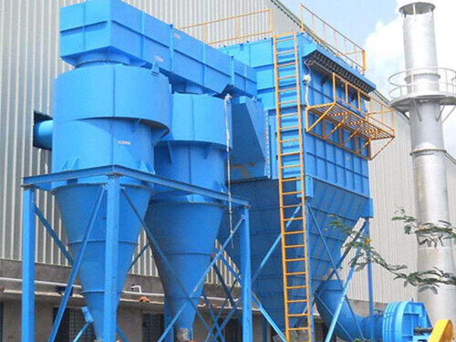 Blue twin cyclone dust collectors with conical bodies and top outlet ducts beside a baghouse and stack