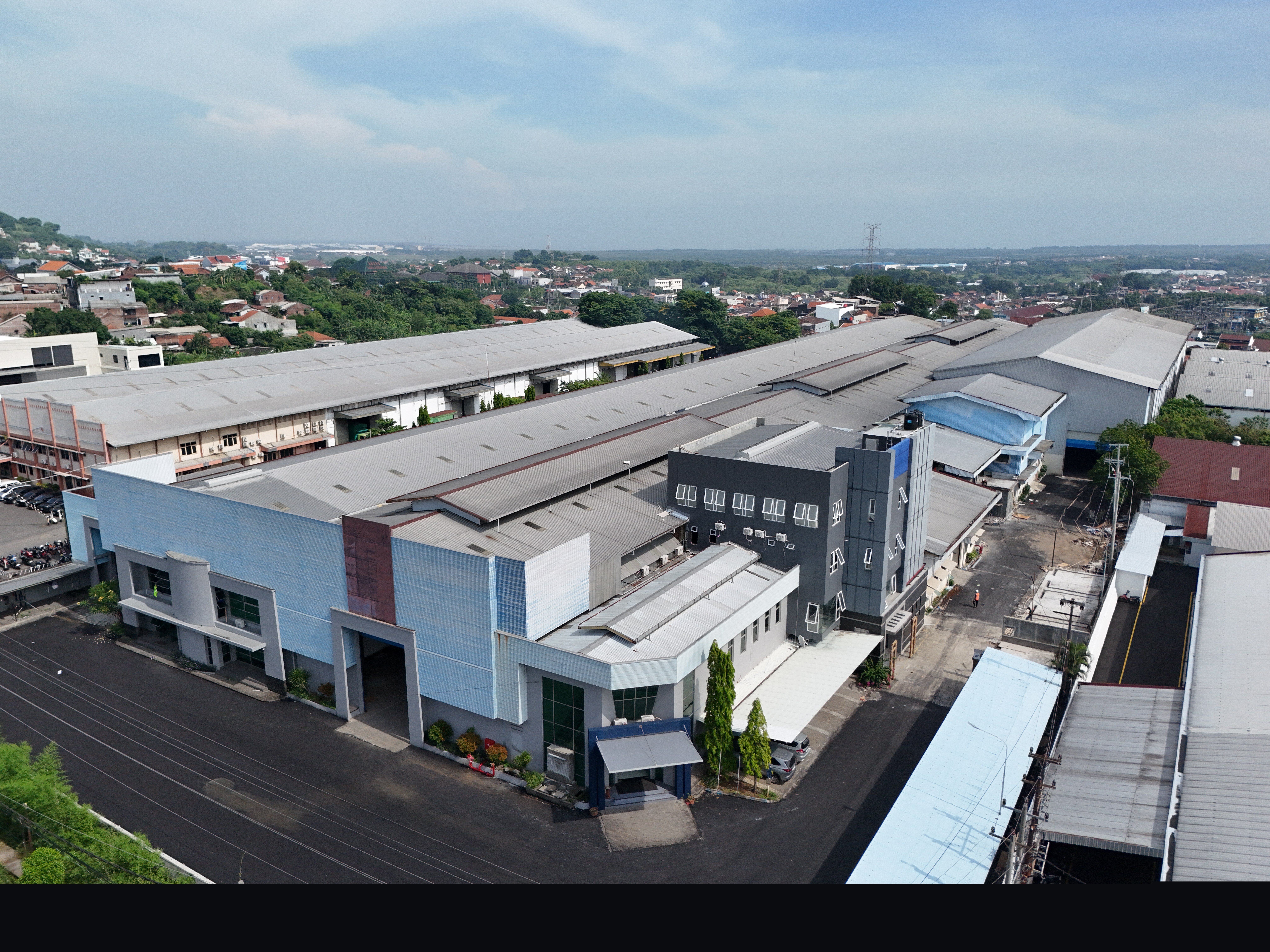 Aerial drone view of factory building exterior