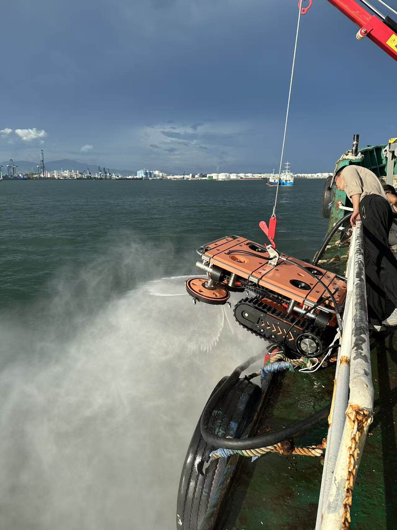 CAVI dual-disk cleaning robot deployed from a vessel at sea