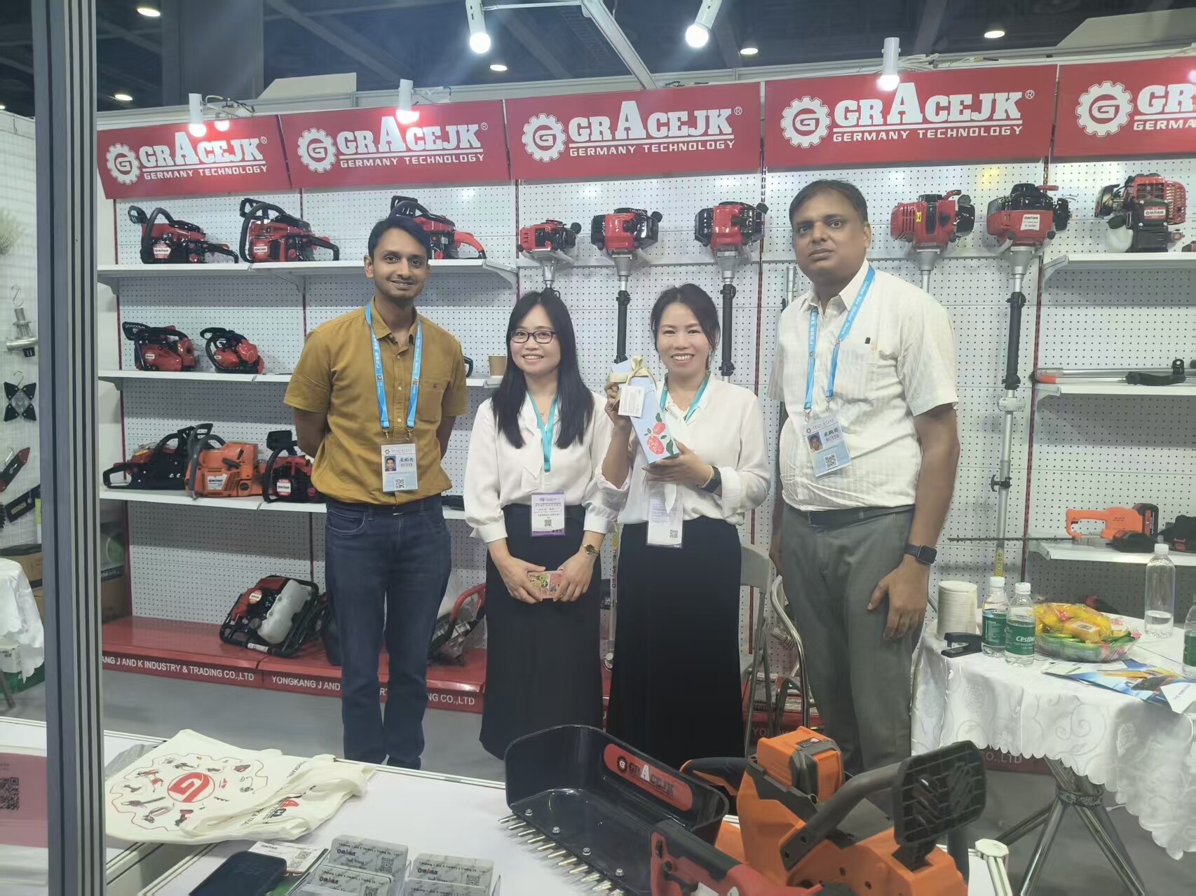 GRACEJK Team with Indian Clients at Trade Show Booth