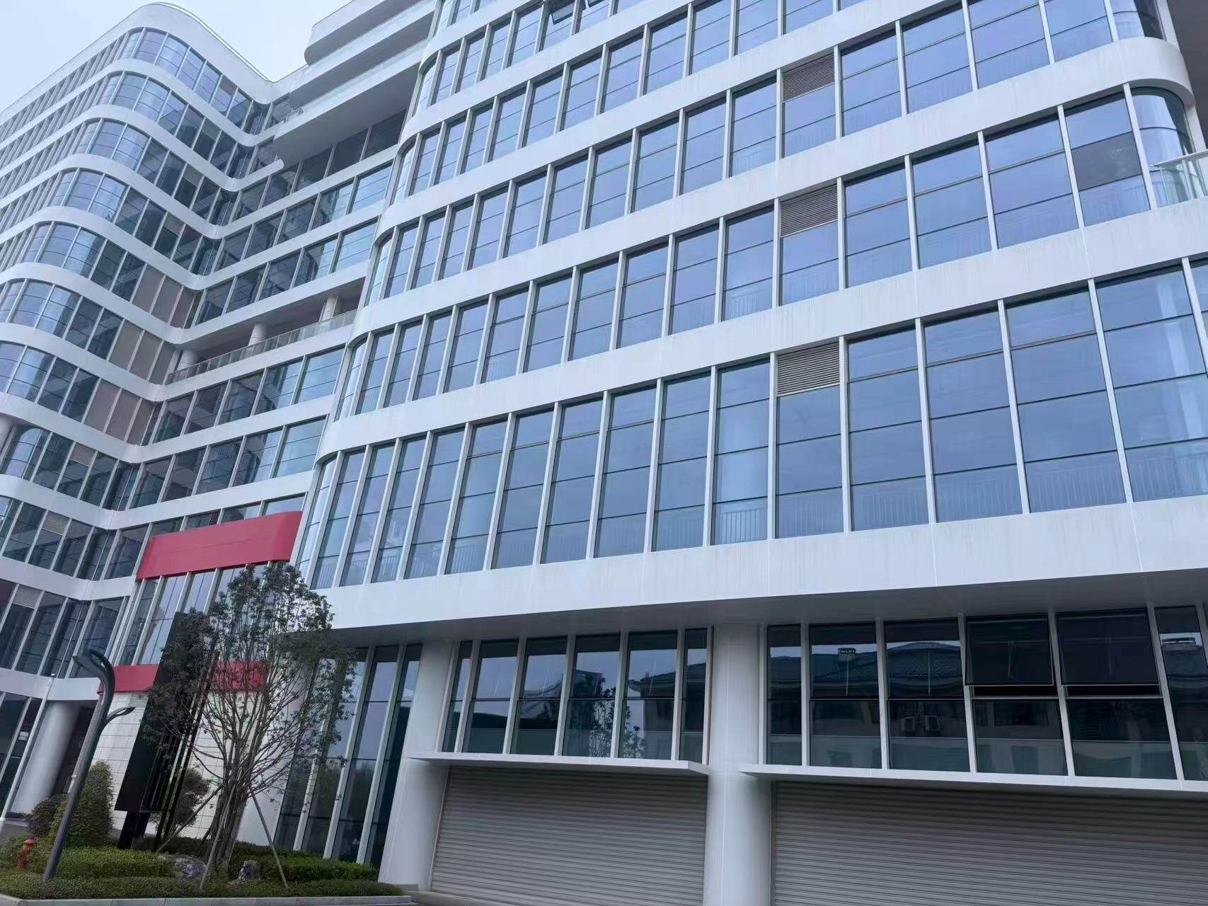 Modern White Factory Building Exterior with Glass Windows