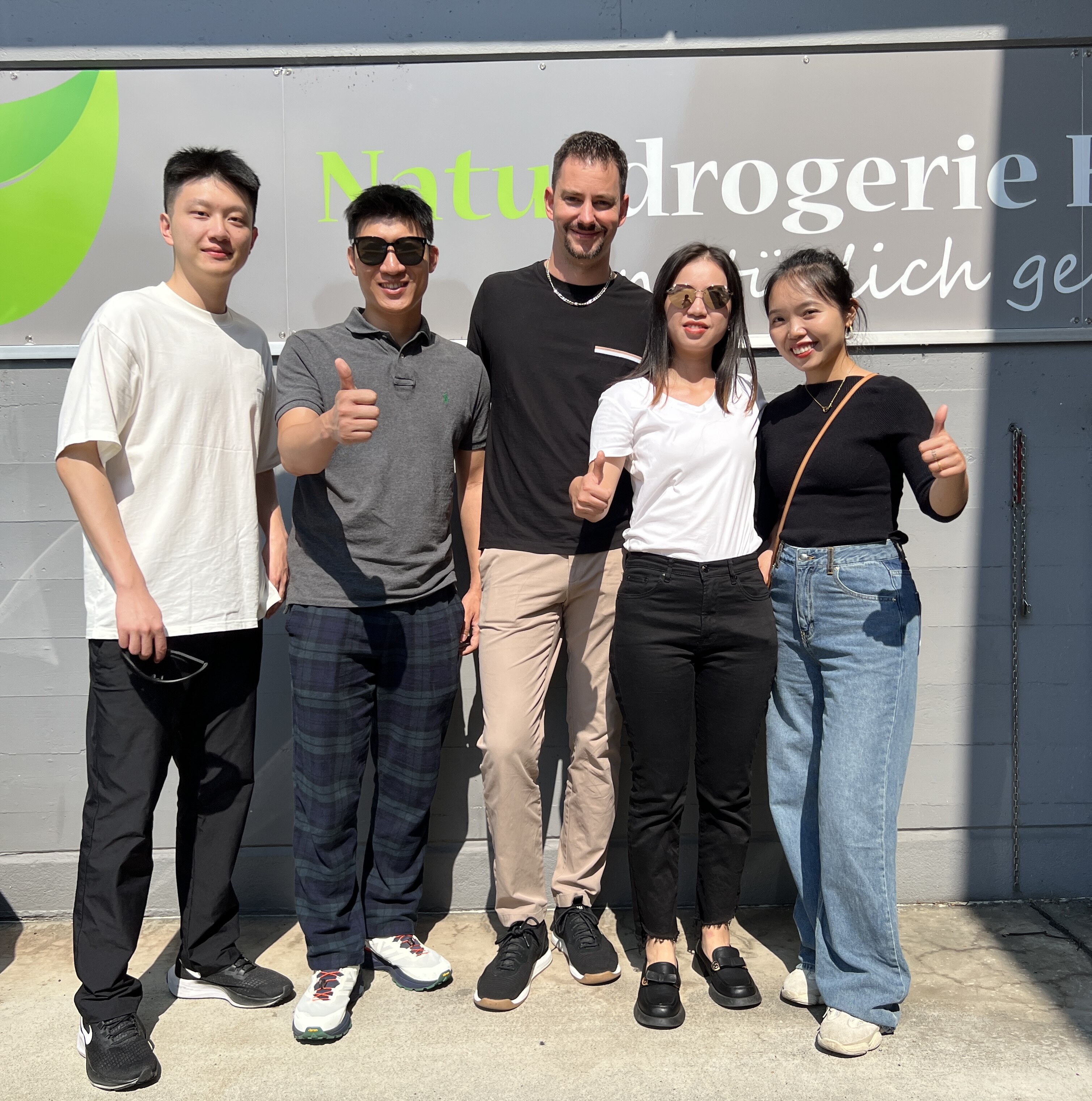 EASTERN ELLS Chinese team collaborating in modern Shanghai office