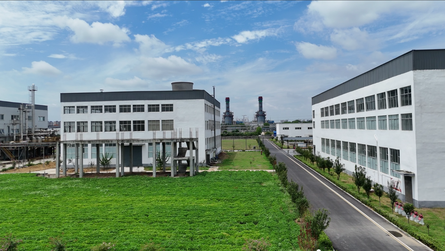 Factory Buildings with Green Lawn