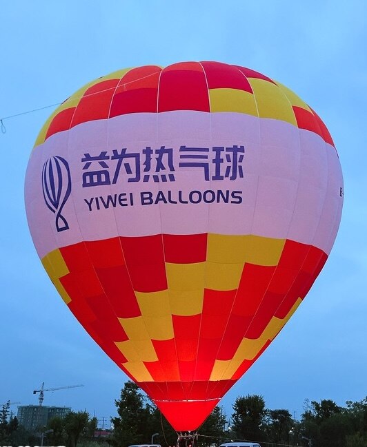 Yiwei Brand Balloon (Red & Yellow) – Yiwei Hot Air Balloon branded balloon in red and yellow with "YIWEI BALLOONS" logo, ideal for brand promotion.