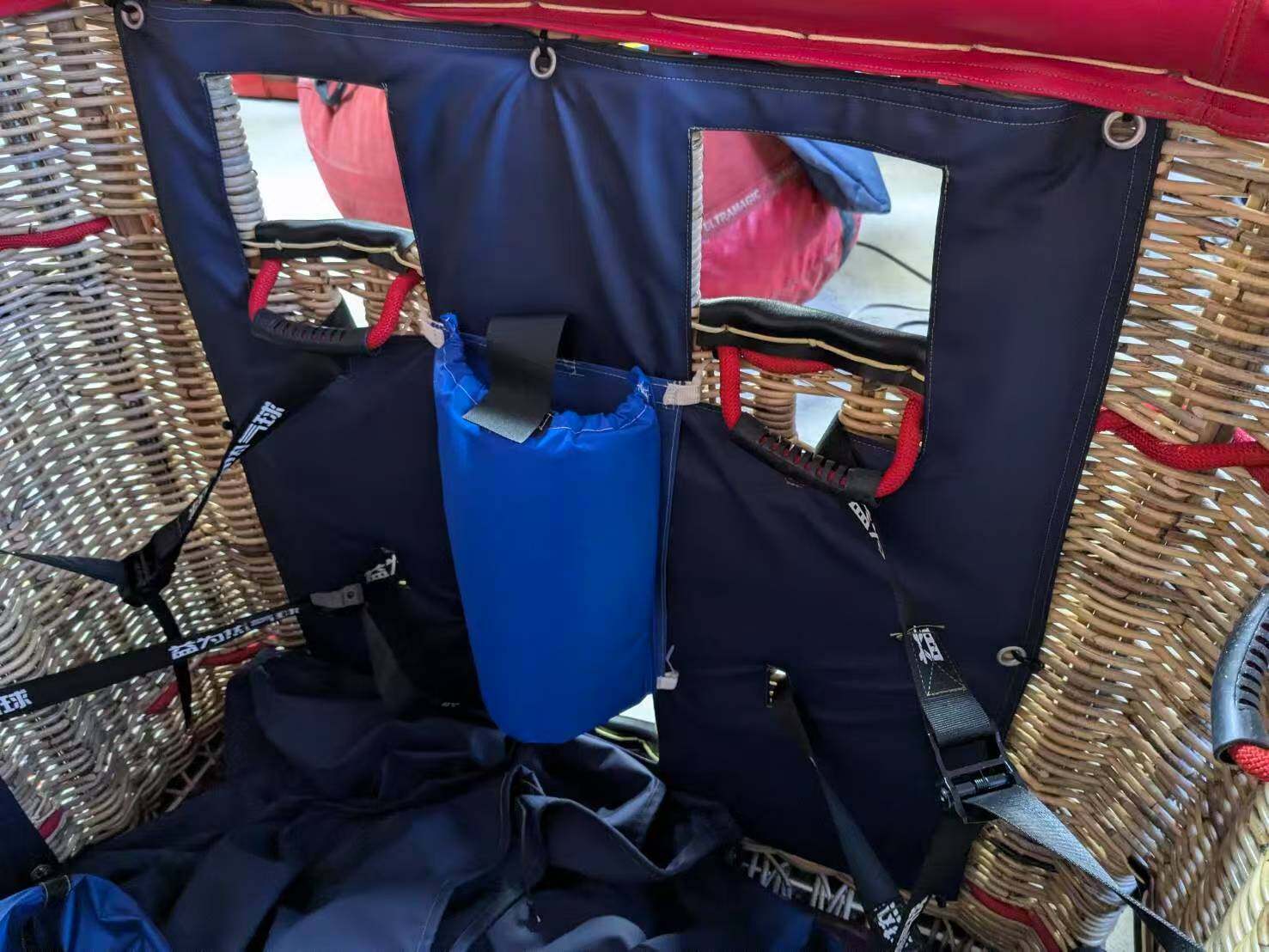 Yiwei Balloons Basket Interior with Safety Harness System Yiwei Balloons basket interior with blue safety harness and passenger seating