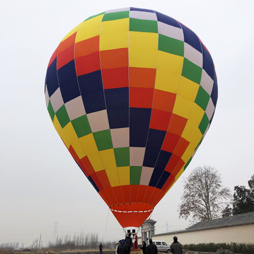 Colorful Checkered Manned Hot Air Balloon Inflation - Manned Hot-Air Balloons by Yiwei Balloons - Colorful checkered manned hot air balloon being inflated with crew preparing for flight, showcasing professional balloon operations.
