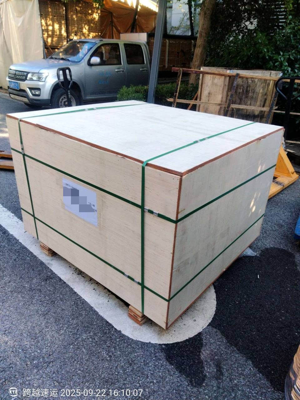 Custom Hot Air Balloon Shipment to Laos - Wooden Crate Secured with Green Straps Yiwei Balloons custom hot air balloon shipment to Laos - large wooden crate secured with green straps on pallet at factory