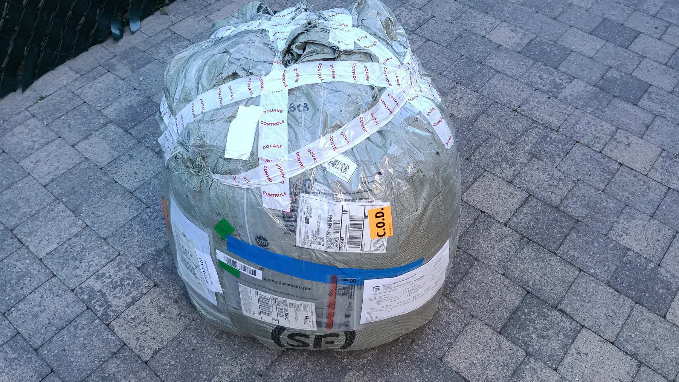 Rooster RC Balloon Shipment to Belgium - Packaged Package Yiwei Balloons rooster shaped RC balloon shipment to Belgium - large package wrapped in protective material with customs labels and shipping documentation