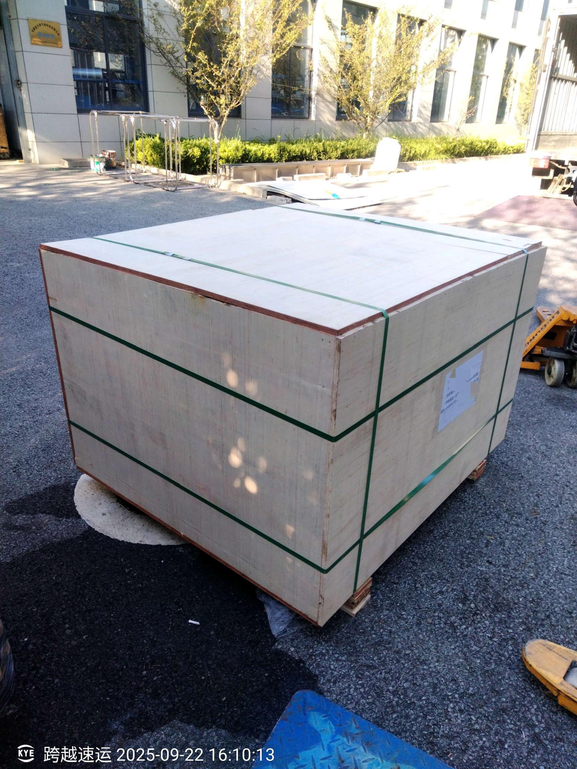 Custom Hot Air Balloon Shipment to Laos - Wooden Crate at Factory Yard Yiwei Balloons custom hot air balloon shipment to Laos - large wooden crate with green straps from different angle at factory yard