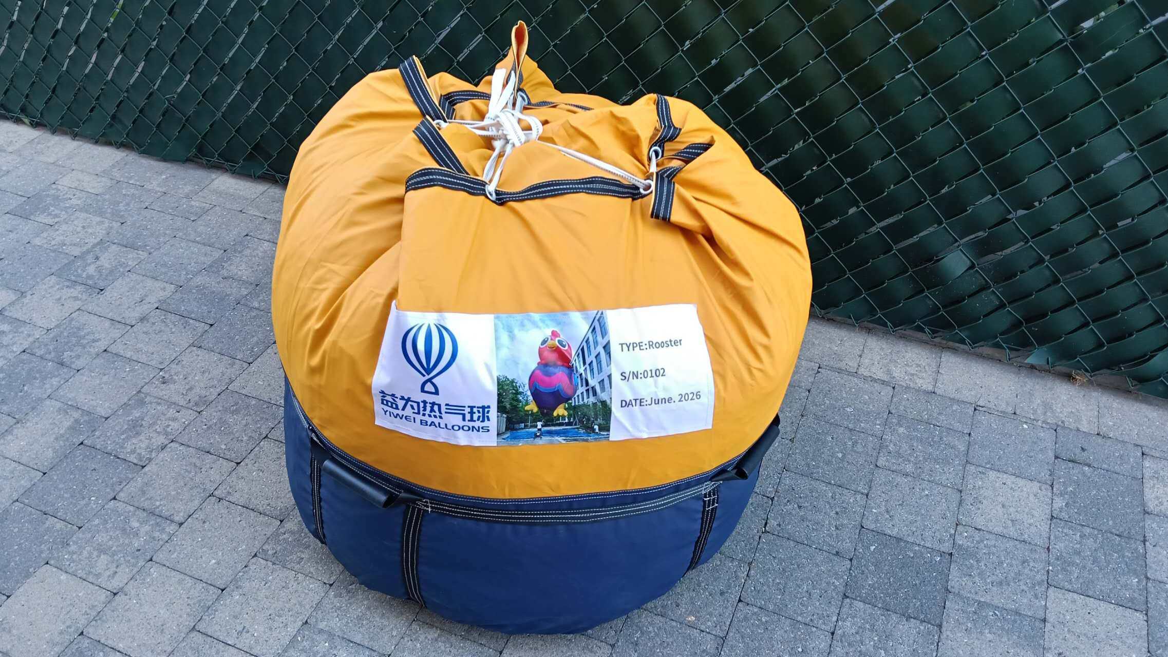 Rooster RC Balloon Packed in Bag - Ready for Shipment Yiwei Balloons rooster shaped RC balloon packed in yellow bag with company label and product information tag for Belgium shipment