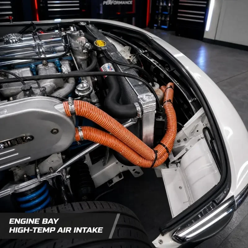 Orange silicone duct hoses routed in an engine bay as high temperature air intake ducts