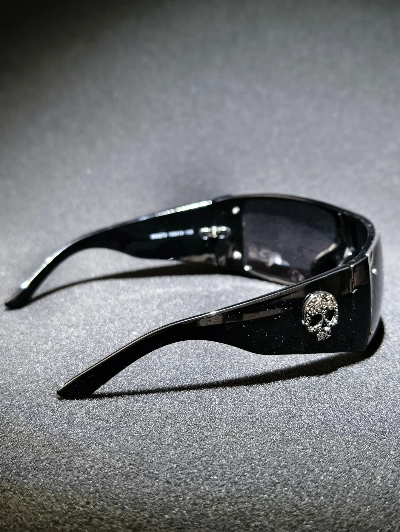Chrome Emboss Shades — Sculpted shield front with a chrome-finish skull embossed on the temple.