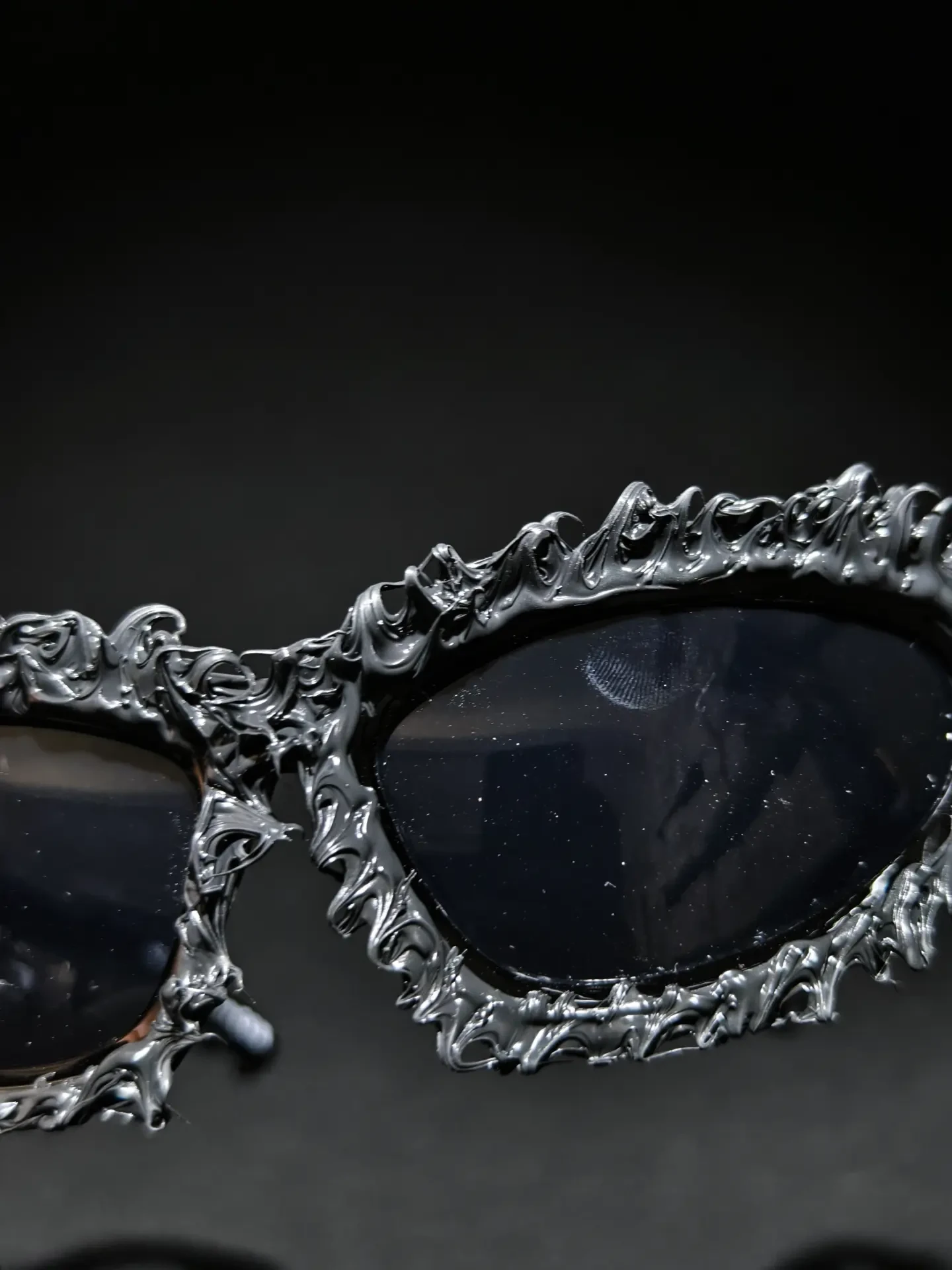 Relic Baroque Shades — Deep relief carving wrapped around two oval lenses.