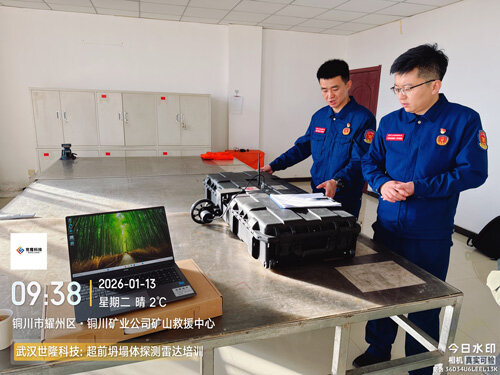 Technicians demonstrating the SL-TPGR advanced detection radar for collapse bodies indoors.