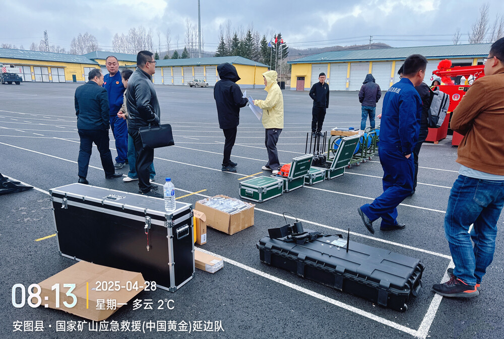Technicians unbox and inspect ground-penetrating radar equipment at the parking lot.