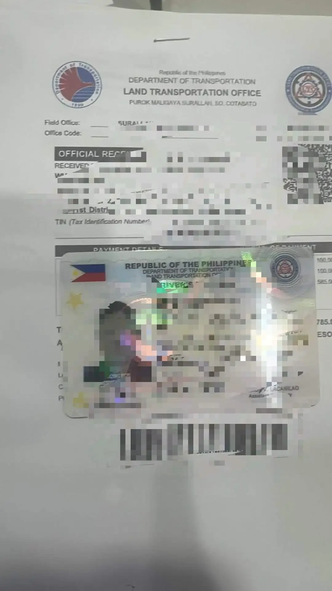 LTO 现场出具的官方收据与驾驶证卡(证件信息已作遮挡处理)