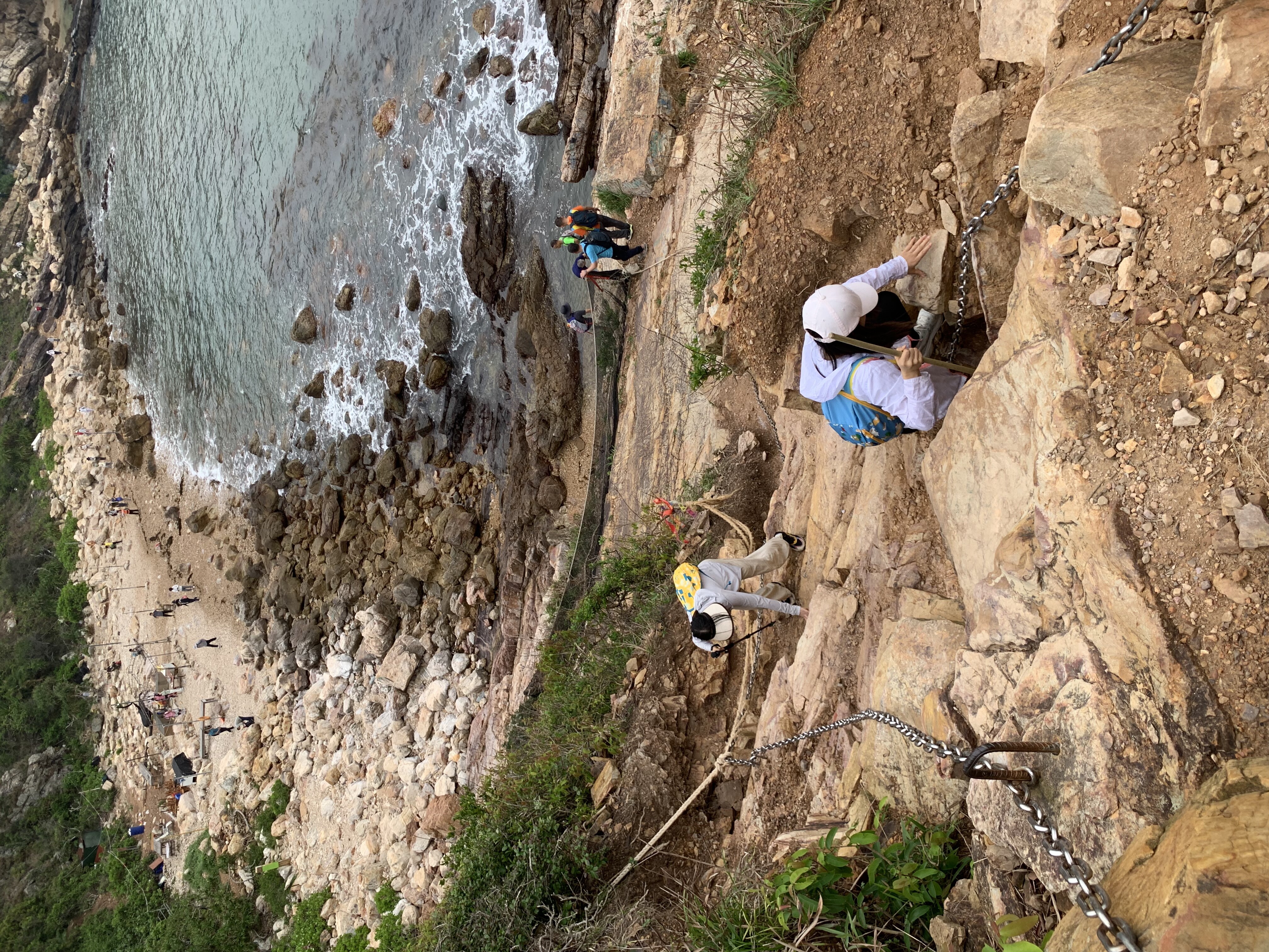 Coastal cliff chain climbing