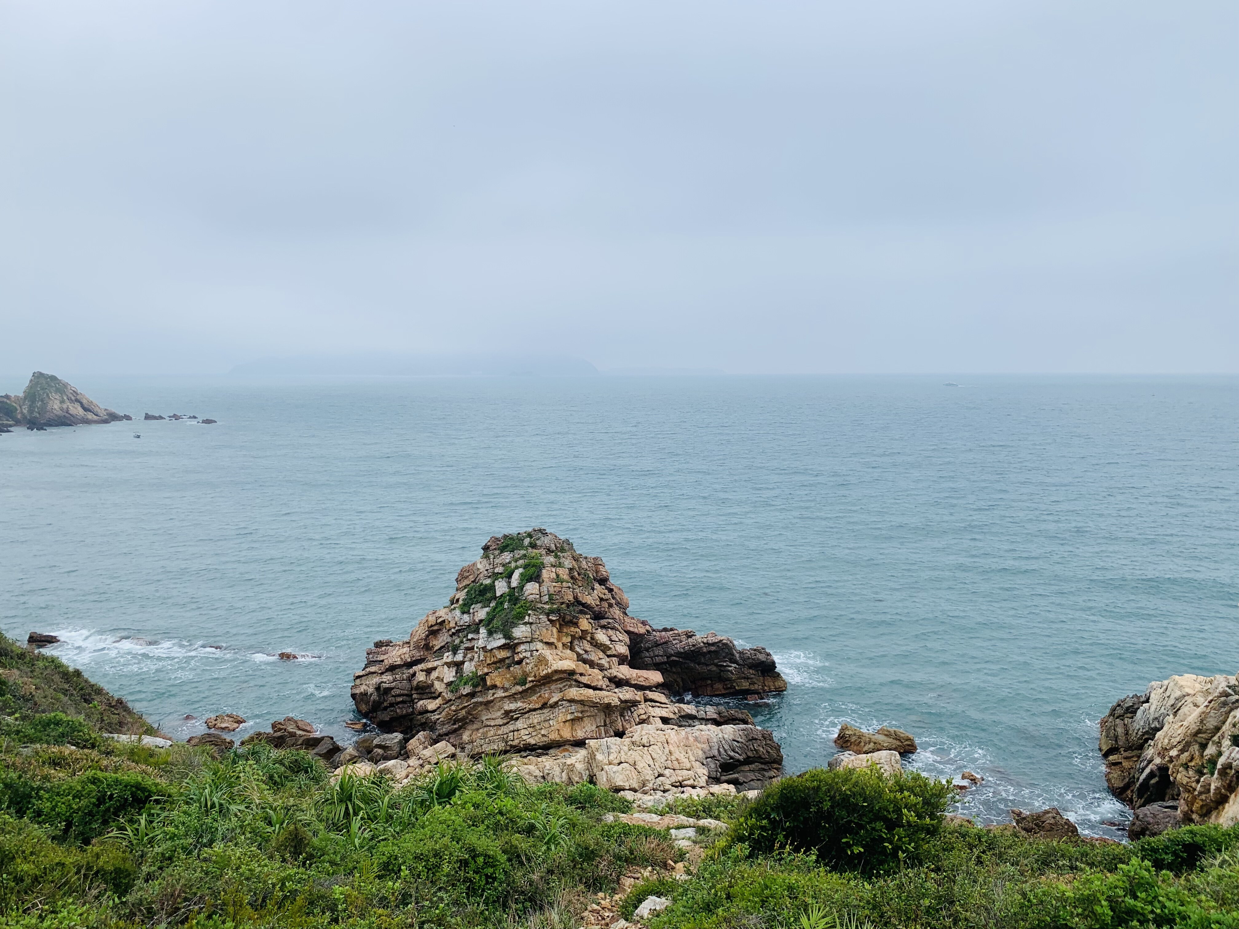 Rocky coastline with misty sea