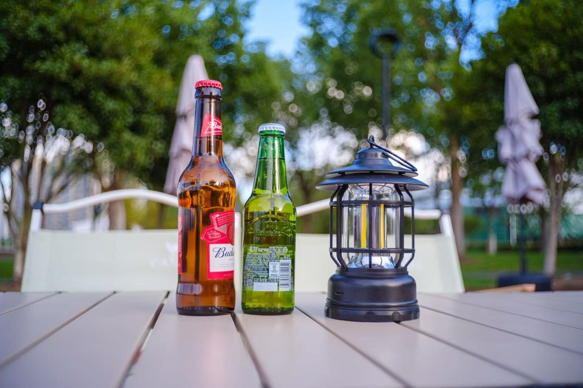 Beer and lamp on an outdoor table