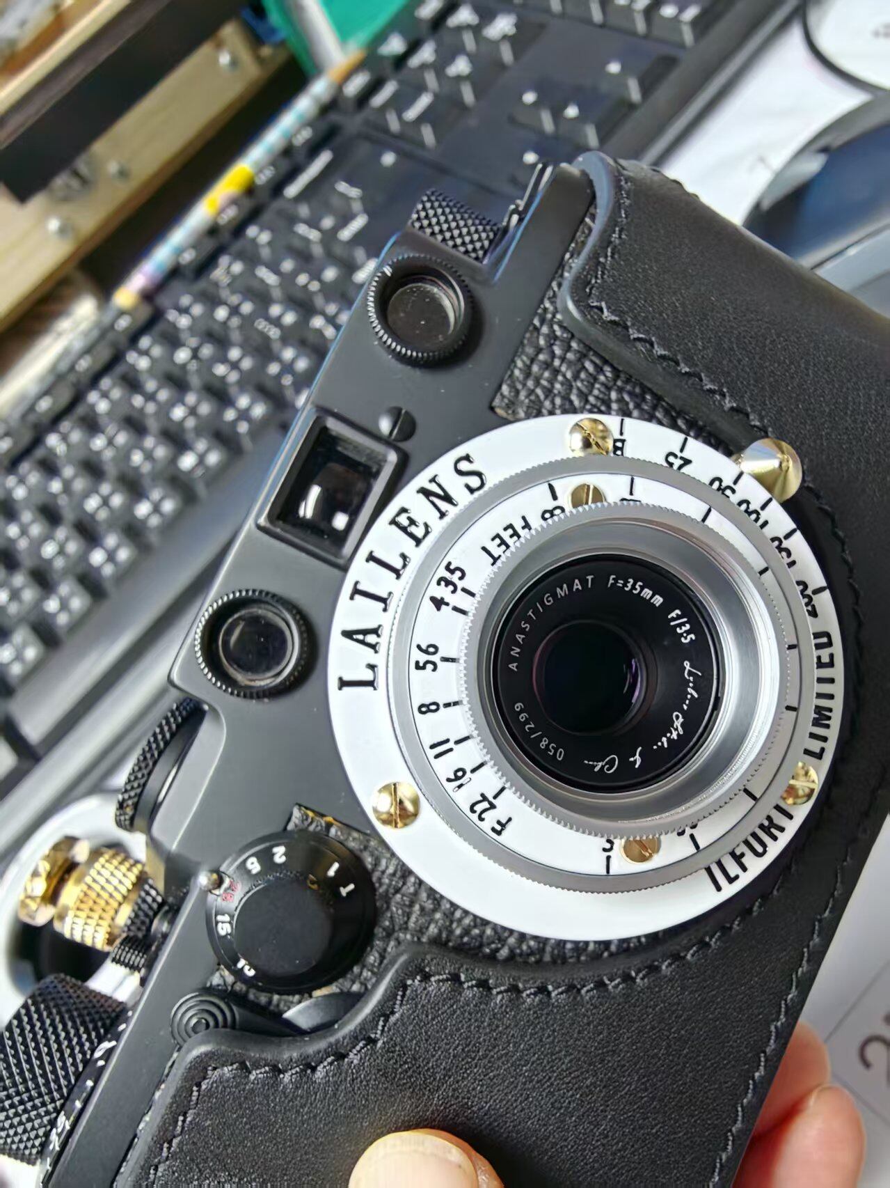 LAILENS lens paired with a black Leica