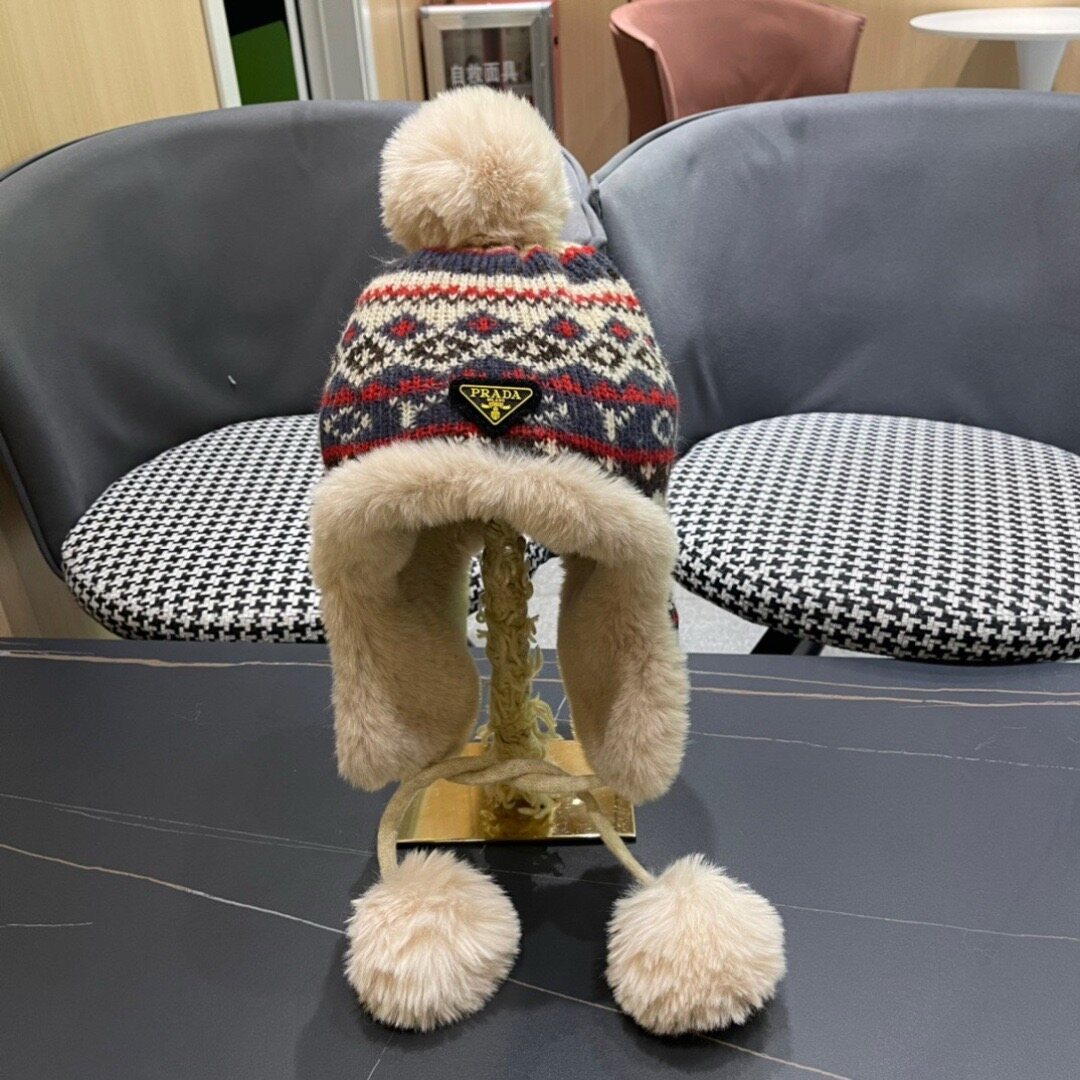 Prada  Prada Fair‑Isle Jacquard Pom‑Pom Furry Ear‑Flap Knit Hat