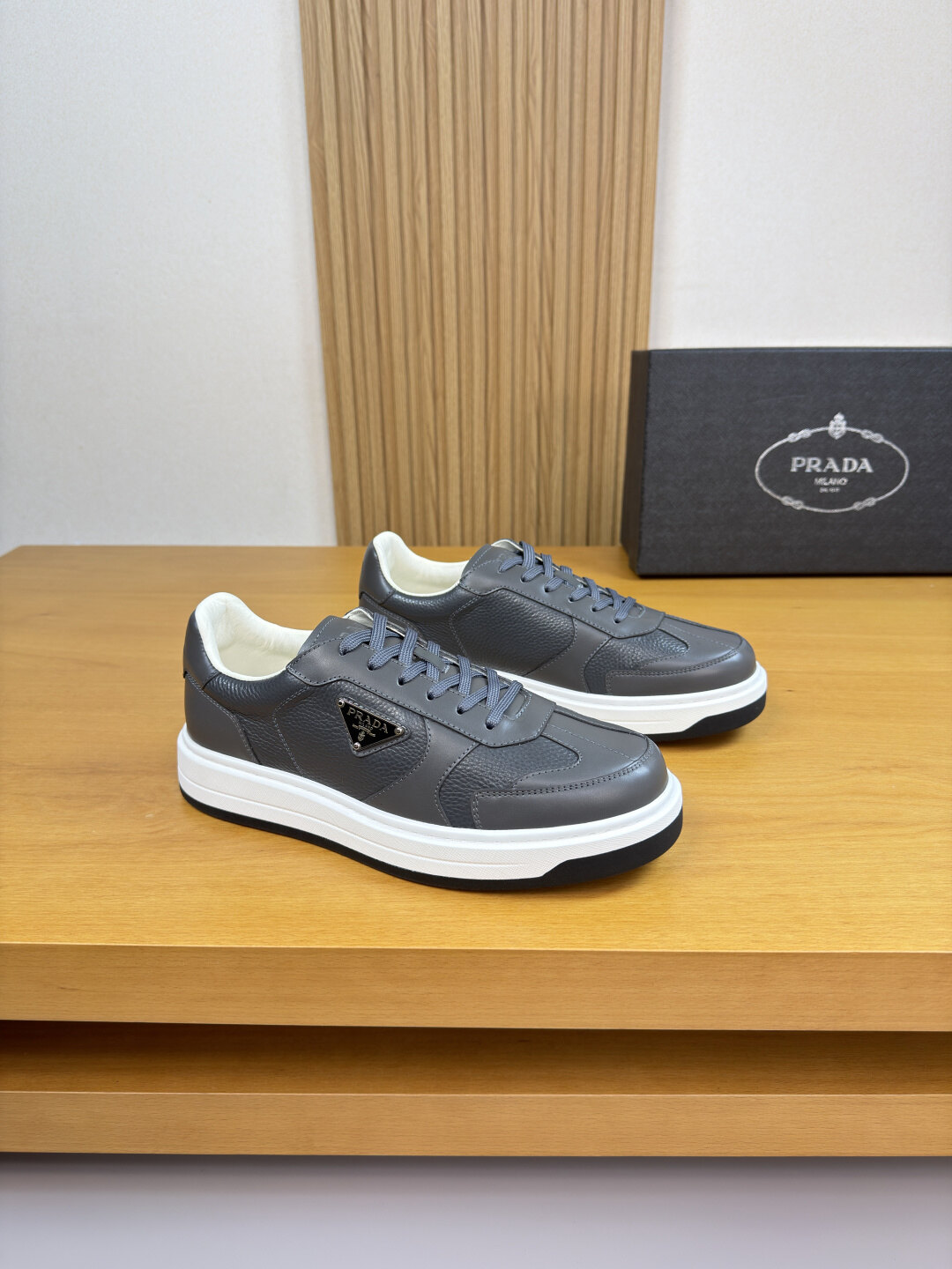 Prada Grey Pebbled Leather Metal Triangle Logo Low-Top Platform Sneakers