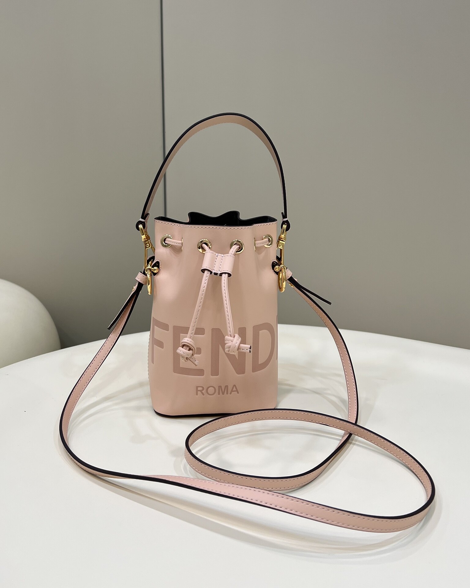 Fendi Light Pink FENDI ROMA Embossed Mini Drawstring Bucket Crossbody Bag
