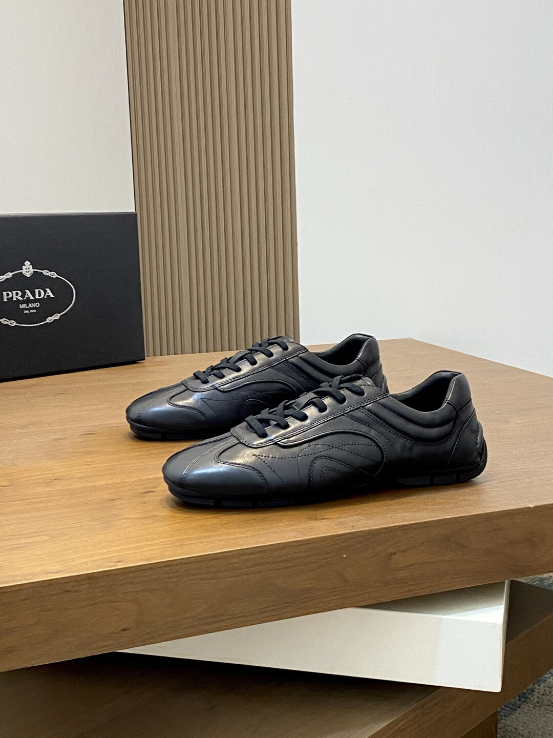 Prada  All Black Smooth Leather Minimal Stitch Low Top Vintage Trainer Sneakers