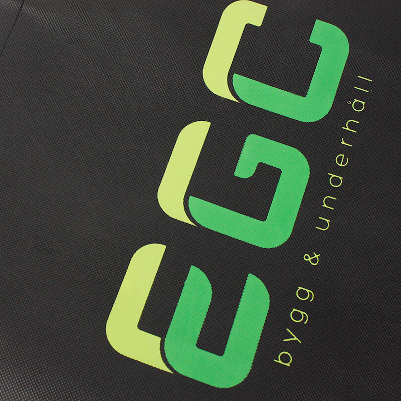 Screen printing service - Custom logo printed on black non-woven tote bag with vibrant colors