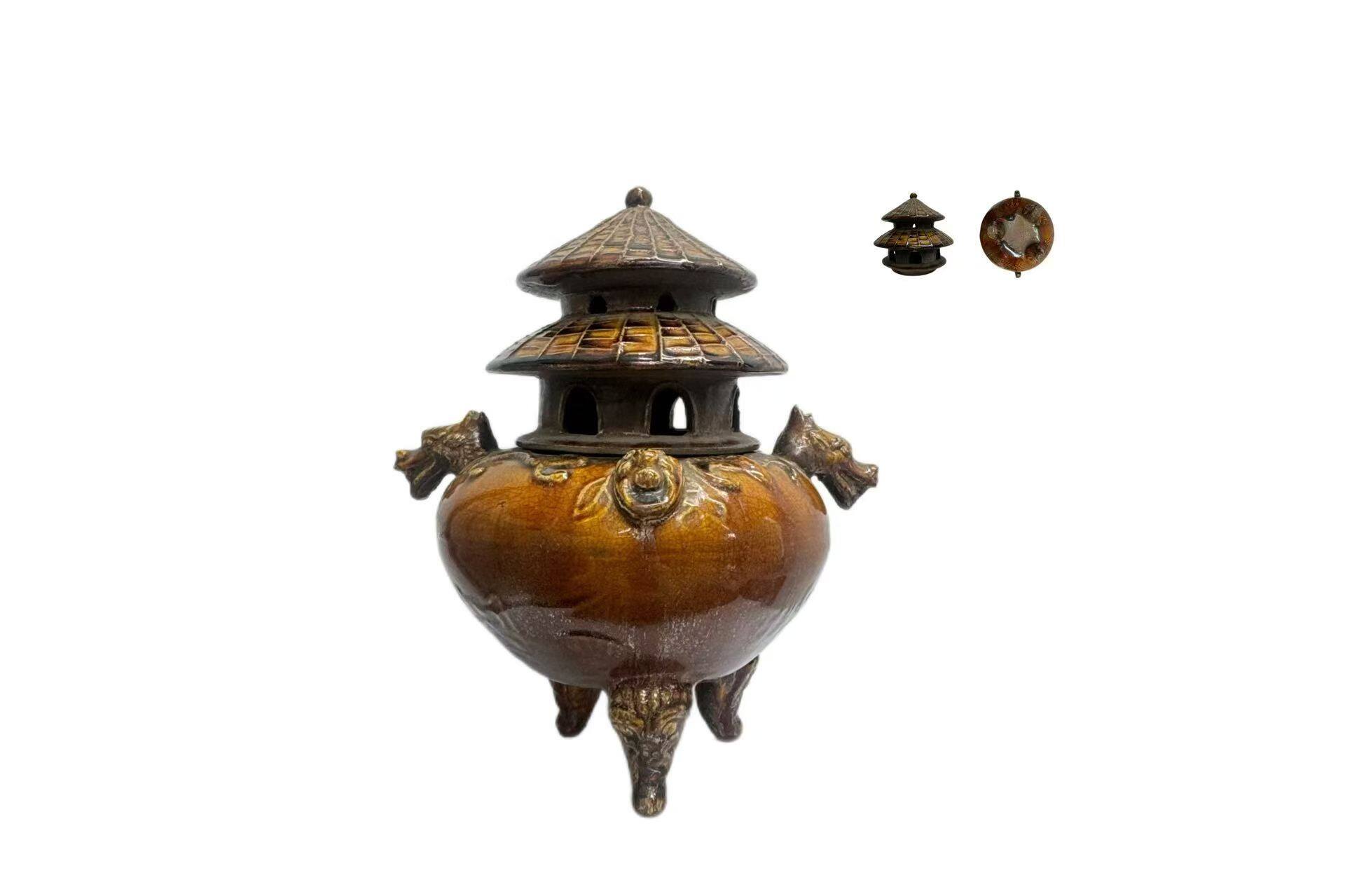 Brown-glazed pavilion-style incense burner with beast-ear handles and three legs
