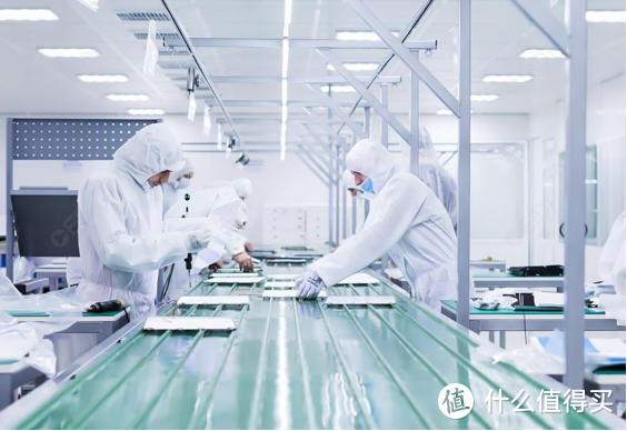 Workers in clean room production facility