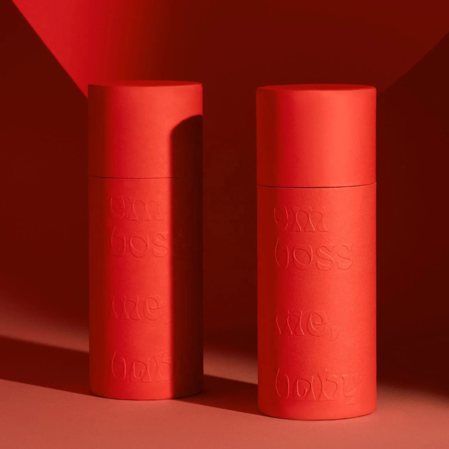 Custom paper tubes in varying sizes and finishes on white background