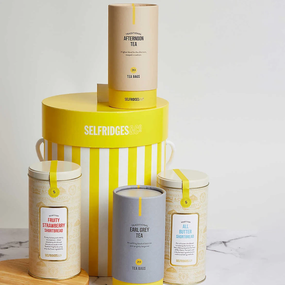 Premium paper packaging collection: tubes, gift box, and shopping bag