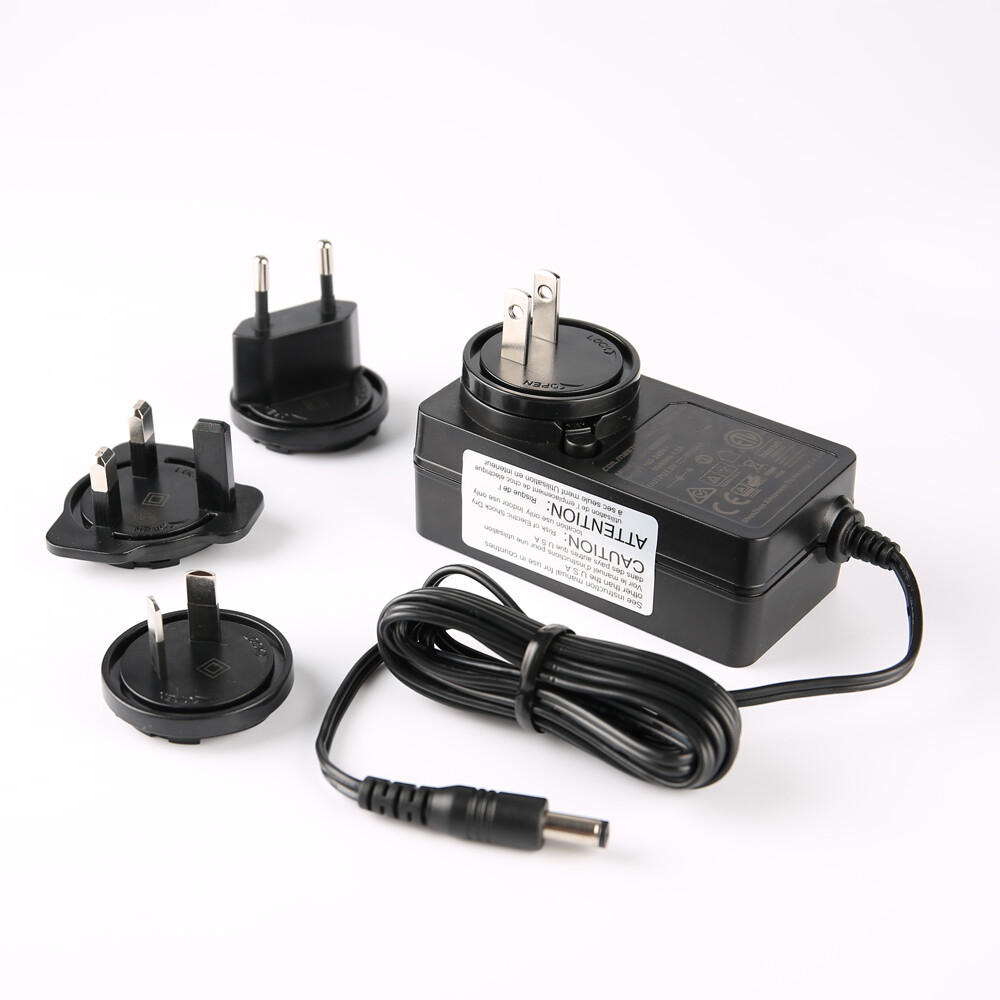 Interchangeable Plug Adapters - Versatile power adapters with interchangeable plug heads (US/EU/UK/AU) for international travel and multi-region use. cover power outputs from 4.5 Watts to 90 Watts, catering to various power requirements. The universal input of 100-240VAC allows the power supplies to be used globally, adapting to the requirements in different countries. Additionally, the wide output voltage range from 5V to 56V provides flexibility for diverse applications, ensuring the power supplies meet the specific needs of various devices. Certified for whole series: UL 62368-1, 60601 CAN/CSA C22.2 No. 62368-1, 60601,TUV EN 62368-1, 60601, CB IEC 62368-1, 60601,FCC Part 15B, CE EMC(EN 55032+EN 55035), CCC, UKCA