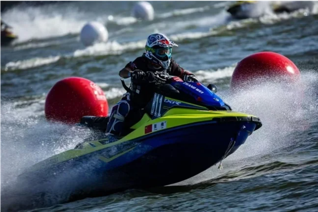 Zhang Wei racing a jet ski around a red buoy
