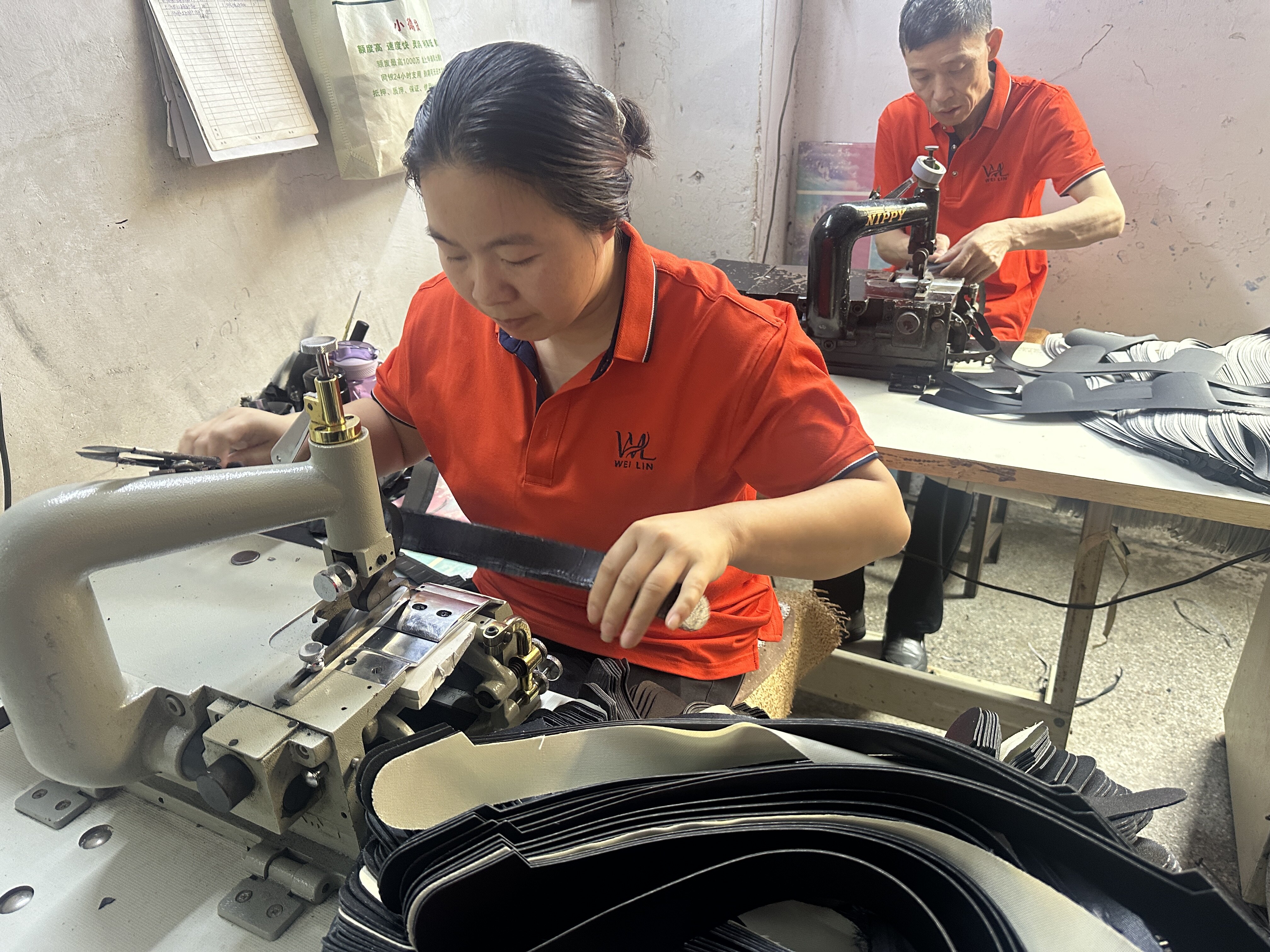 Edge finishing - skilled artisan at sewing machine