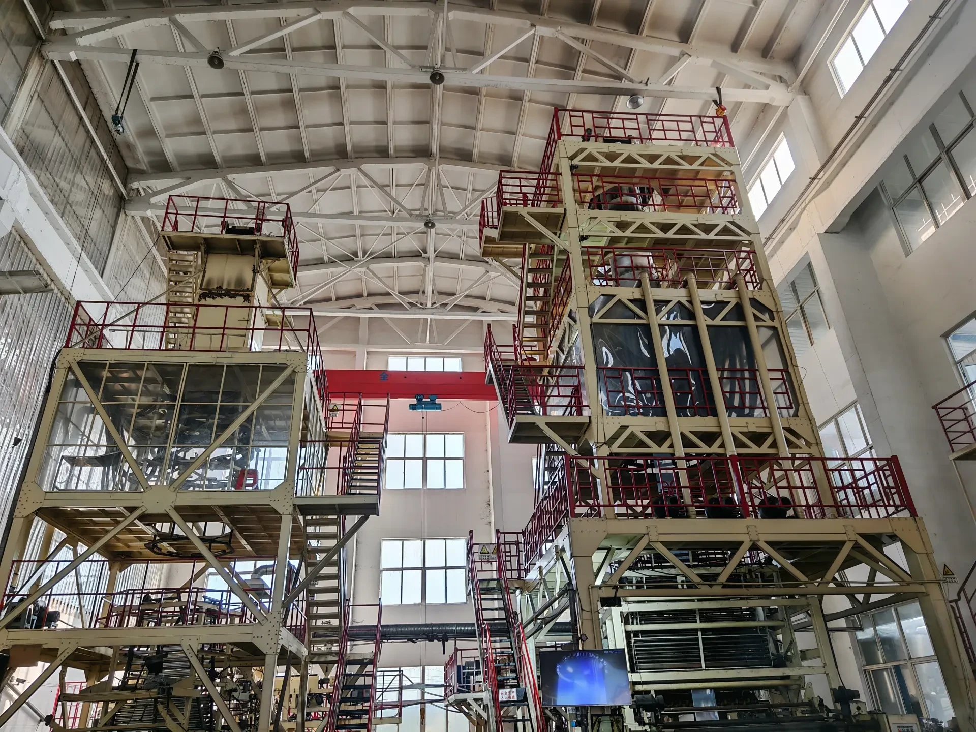 Shrink film blowing towers inside the Huadeli film workshop