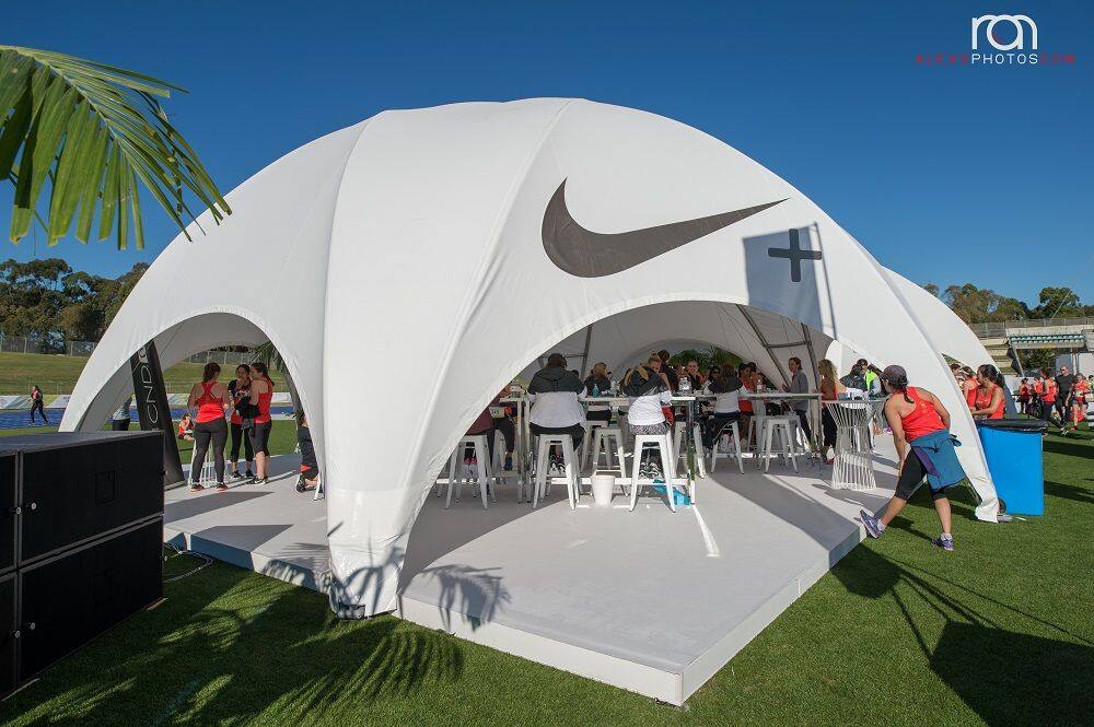Large illuminated event tent venue in the evening