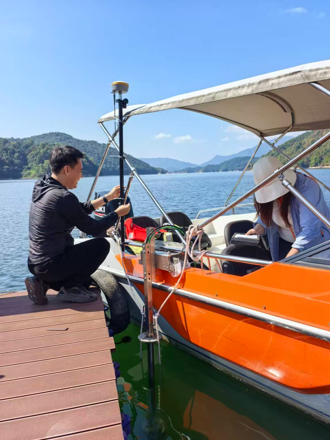 Technicians deploy DVL equipment on the vessel.