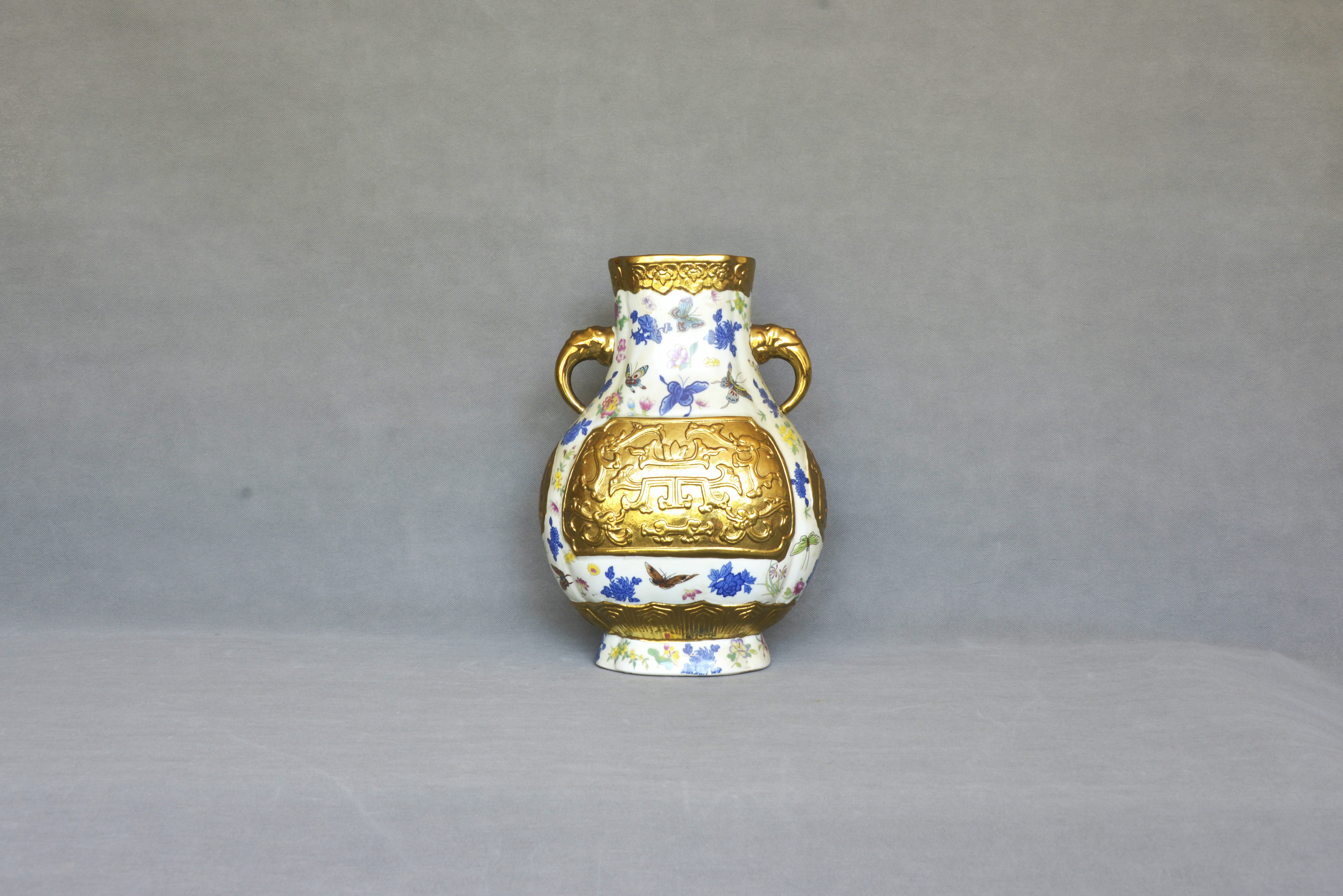 Qianlong Period of the Qing Dynasty, Famille Rose and Blue-and-White Butterfly-in-Flowers Openwork with Gilded Relief Elephant-Eared Begonia Vase 30×23×15cm