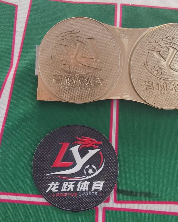 LONGYUE SPORTS finished silicone badges with the LY logo on fabric
