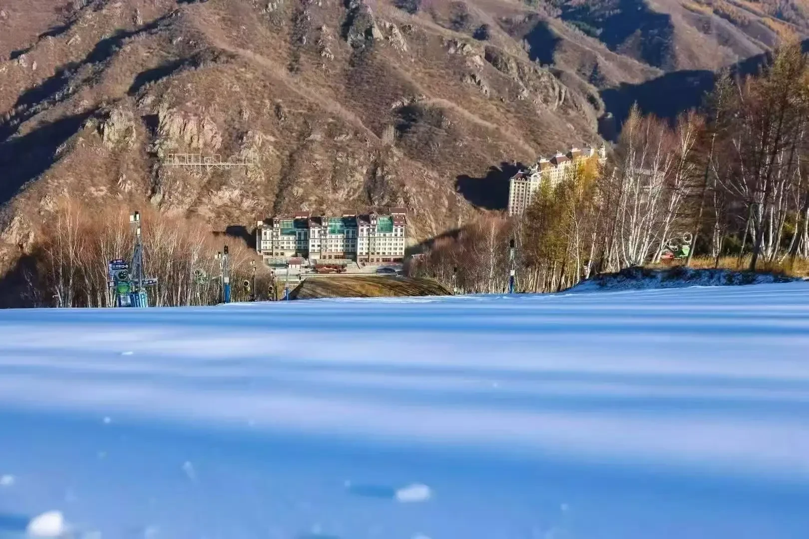 First snow blanket on the lower slopes while the mountains still show autumn colors