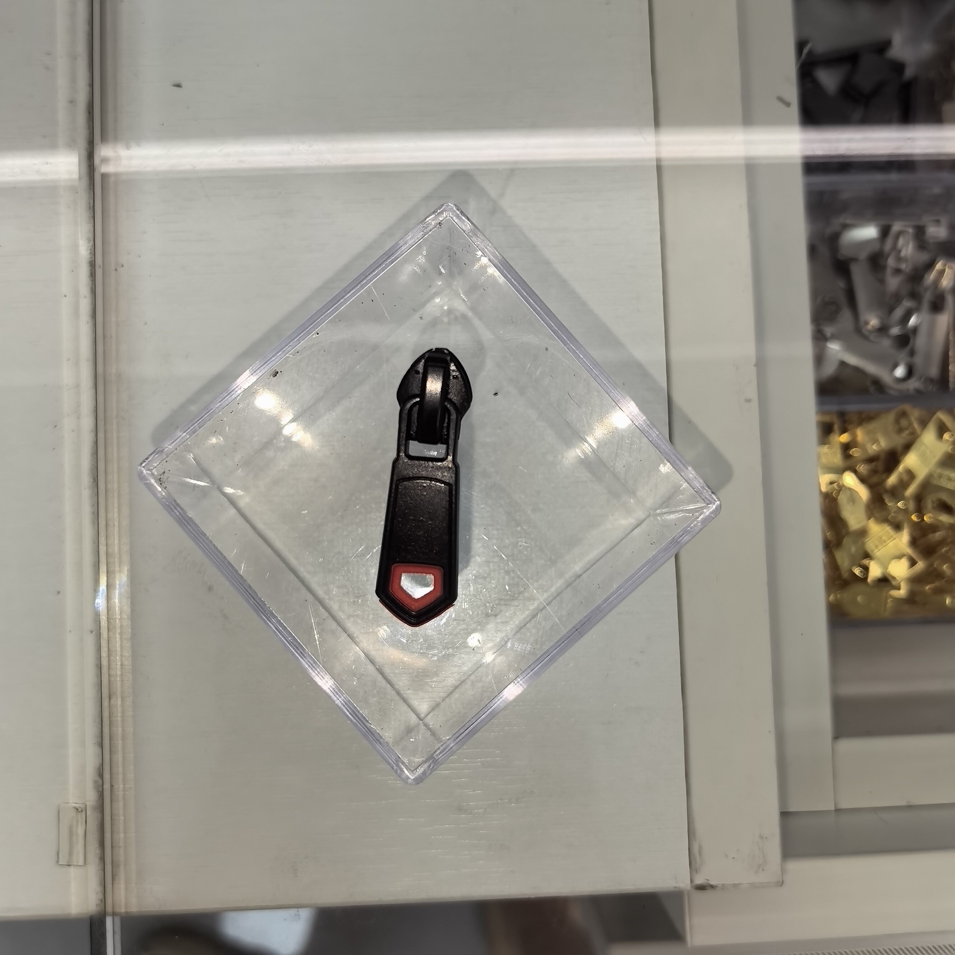 Black pull tab with red label