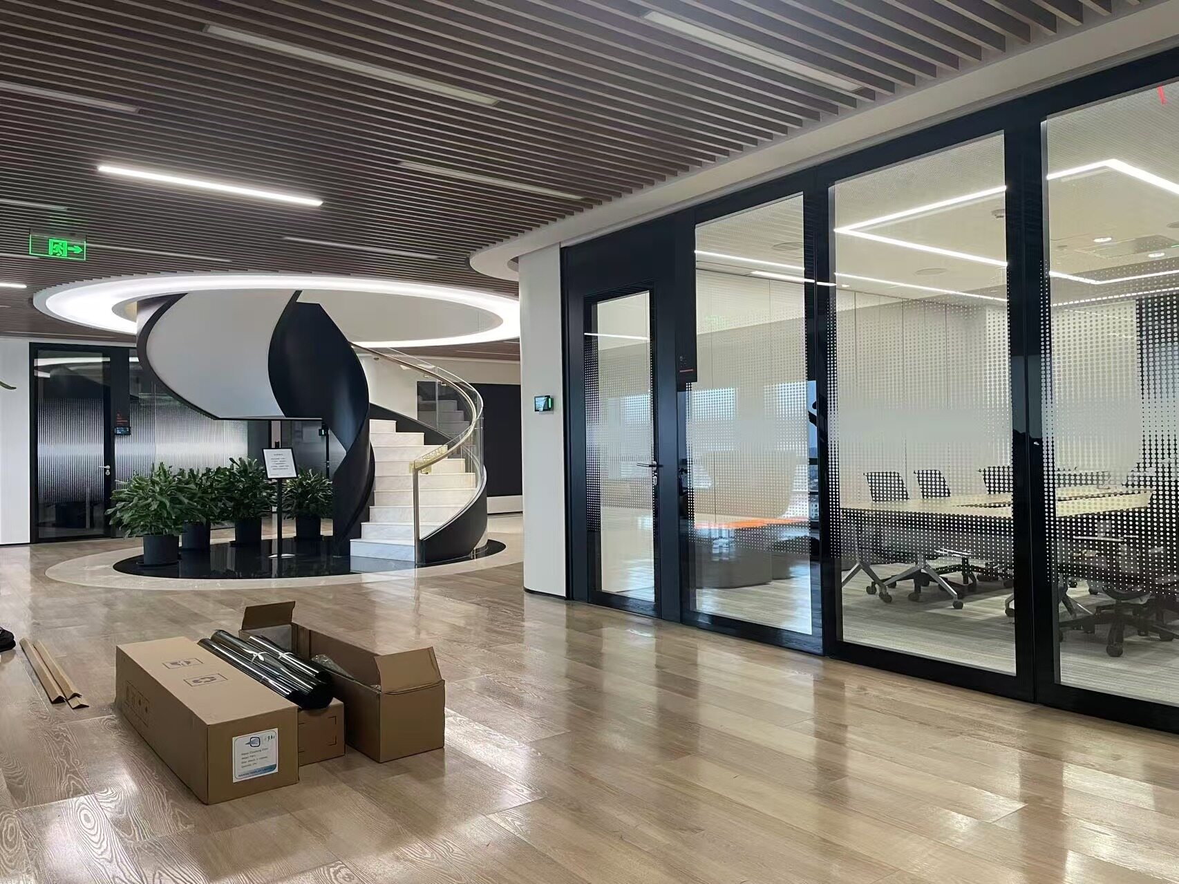 Nano Cloaking Film being installed on glass surface at Illumina facility